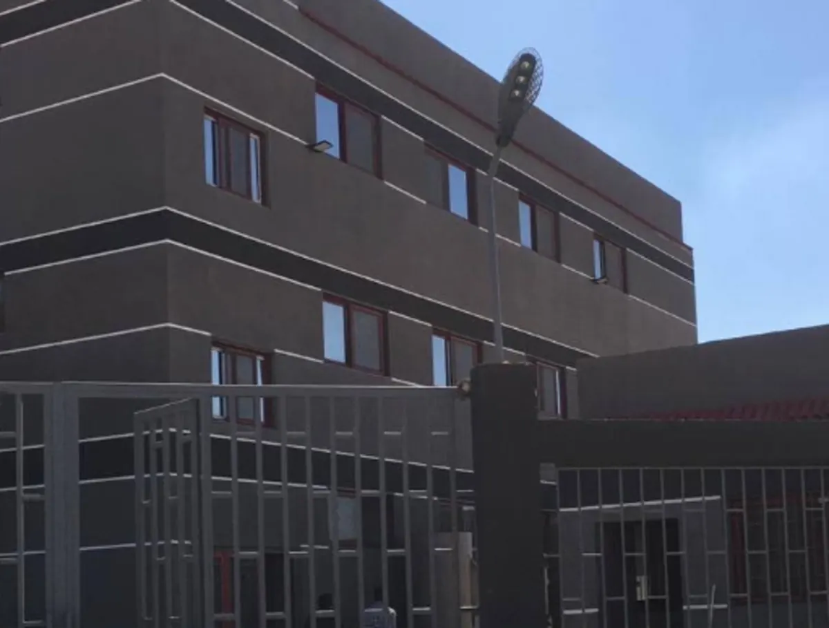 Administration block and gated entrance to the production site.